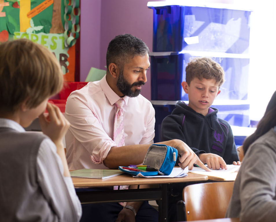 Warren Rodricks helps a pupil