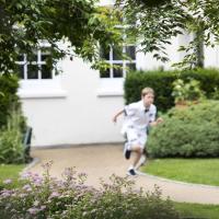 Prep garden with prep boy running