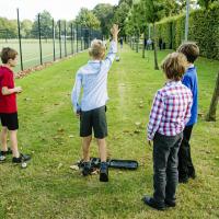 Harrodian prep boys playing boules