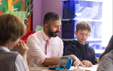 Warren Rodricks helps a pupil