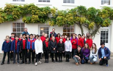 Lowther Primary pupils with Harrodian's Debating team